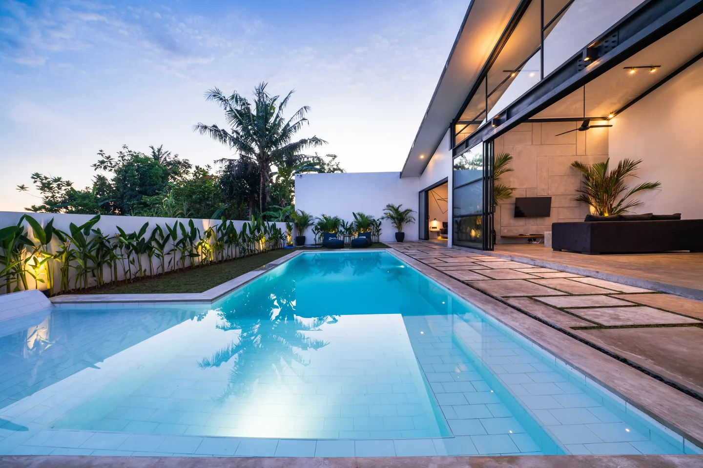 Aerial view of a luxury villa with a pool.